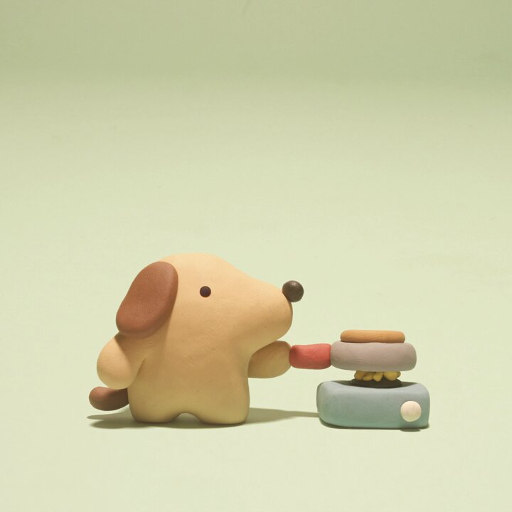 Image of a little clay dog cooking